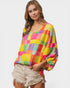 Woman wearing a colorful checkered top on a white background
