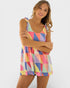 Woman wearing a colorful checkered dress on a white background