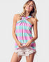 Woman wearing a colorful striped halter top on a white background