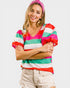 Woman wearing a colorful striped shirt and pink headband on a white background