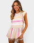 Woman wearing a colorful striped dress on a white background