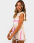 Woman wearing a colorful striped dress on a white background