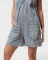 Denim dress with pockets on a plain background