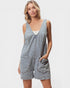 Woman wearing a light blue denim dress on a white background