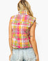 A woman shown from the back wearing a sleeveless quilted vest with a colorful plaid pattern in pink, yellow, green, and white, paired with light-wash distressed denim jeans against a plain white background.