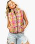 A woman wearing a sleeveless quilted vest with a vibrant pink, yellow, and orange plaid pattern, paired with light-wash distressed denim shorts, against a plain white background.