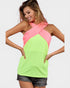 Woman wearing a neon green and pink halter top on a white background