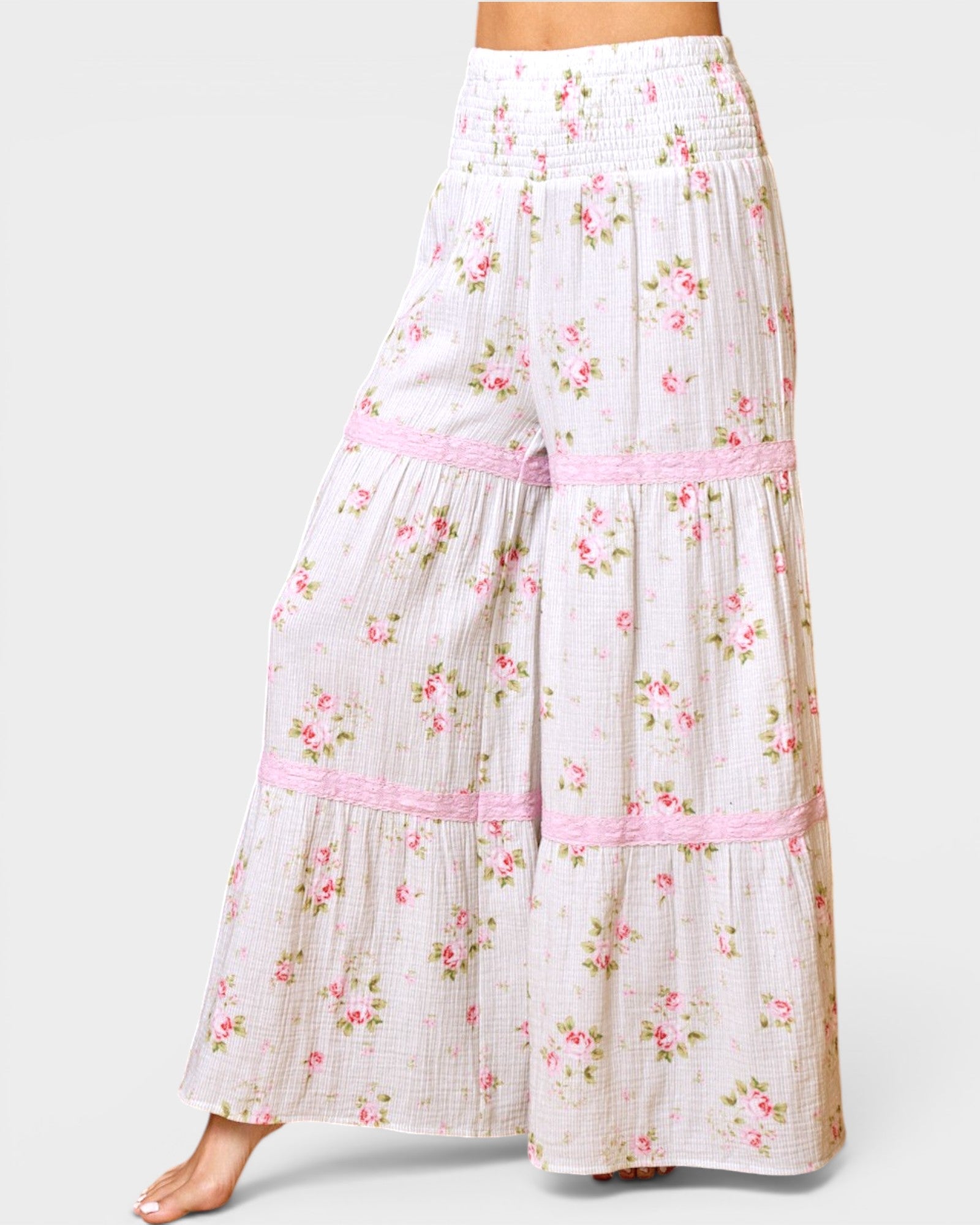 Floral pants with pink accents on a white background