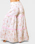 Floral print pants with pink trim on a white background