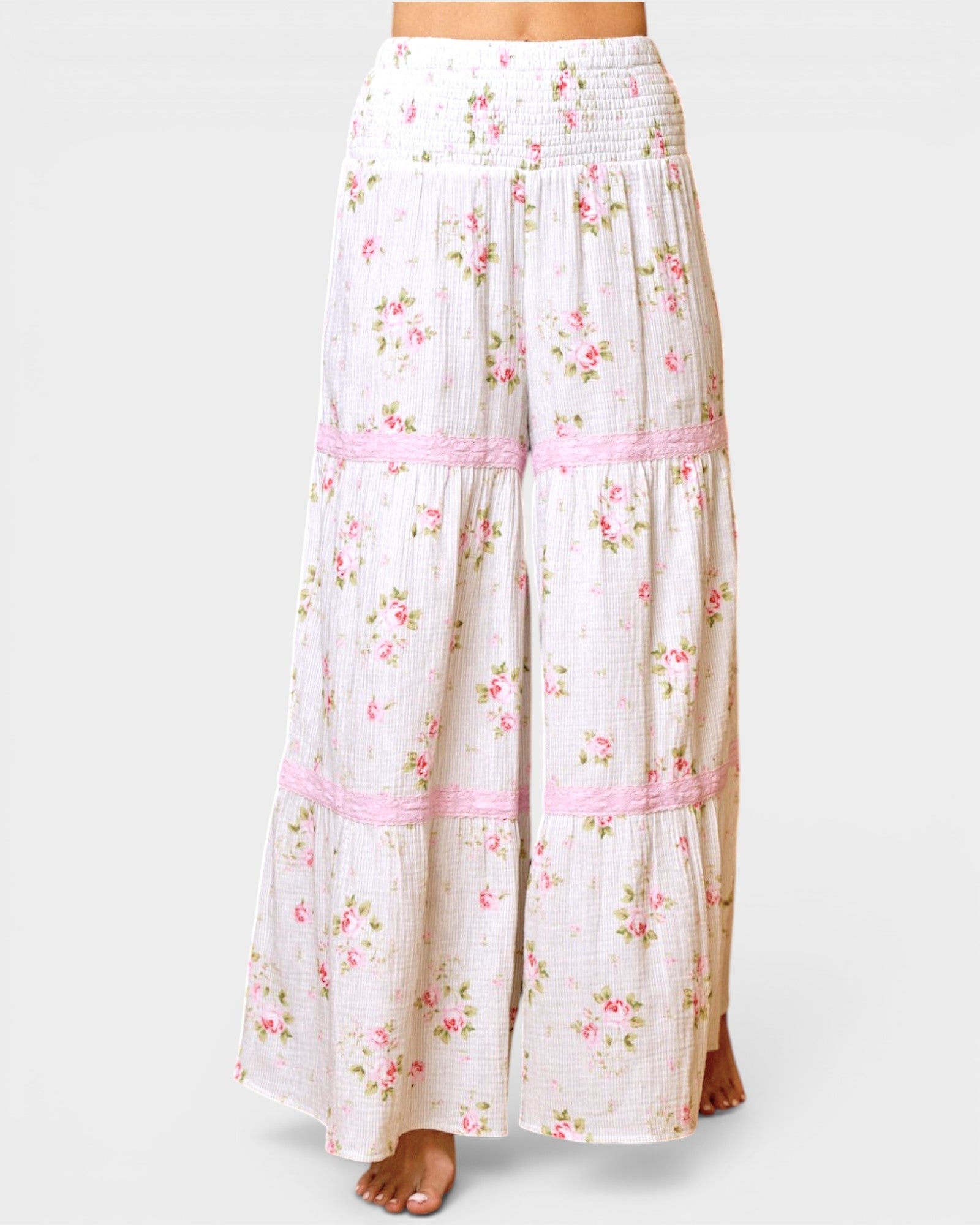 Floral pants with pink accents on a white background