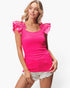 A woman modeling a bright hot pink ribbed knit top with ruffled cap sleeves, paired with light denim shorts, against a plain white studio background.