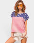 Woman wearing a t-shirt with an American flag design on a plain background