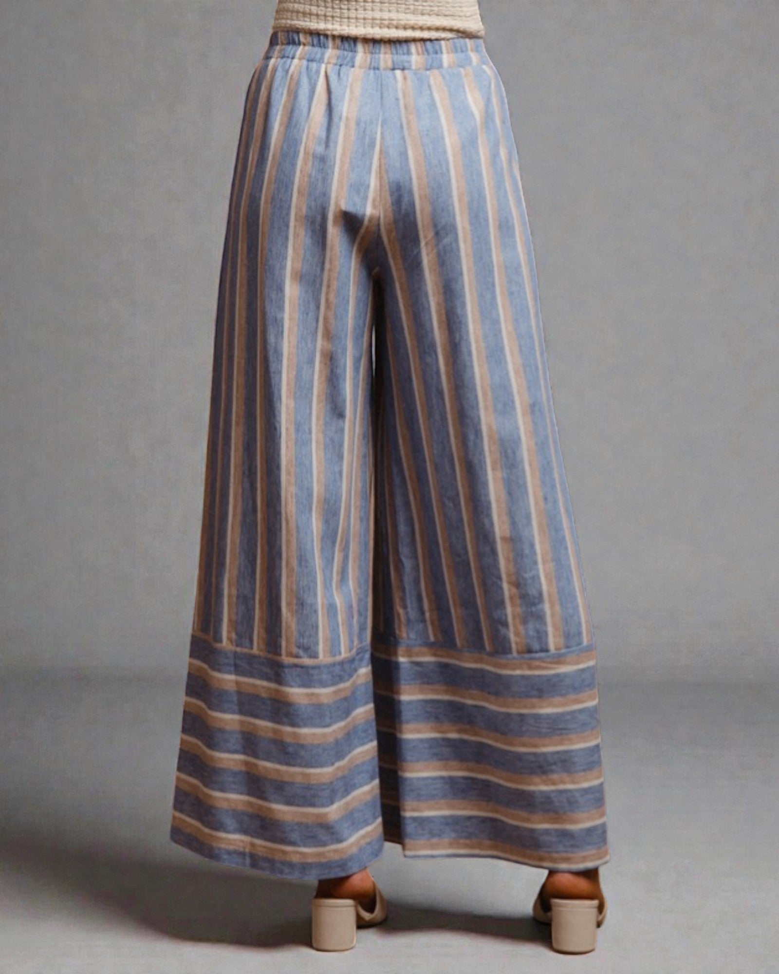 Striped wide-leg pants on a gray background