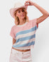 Woman wearing a striped sweater and wide-brimmed hat on a white background