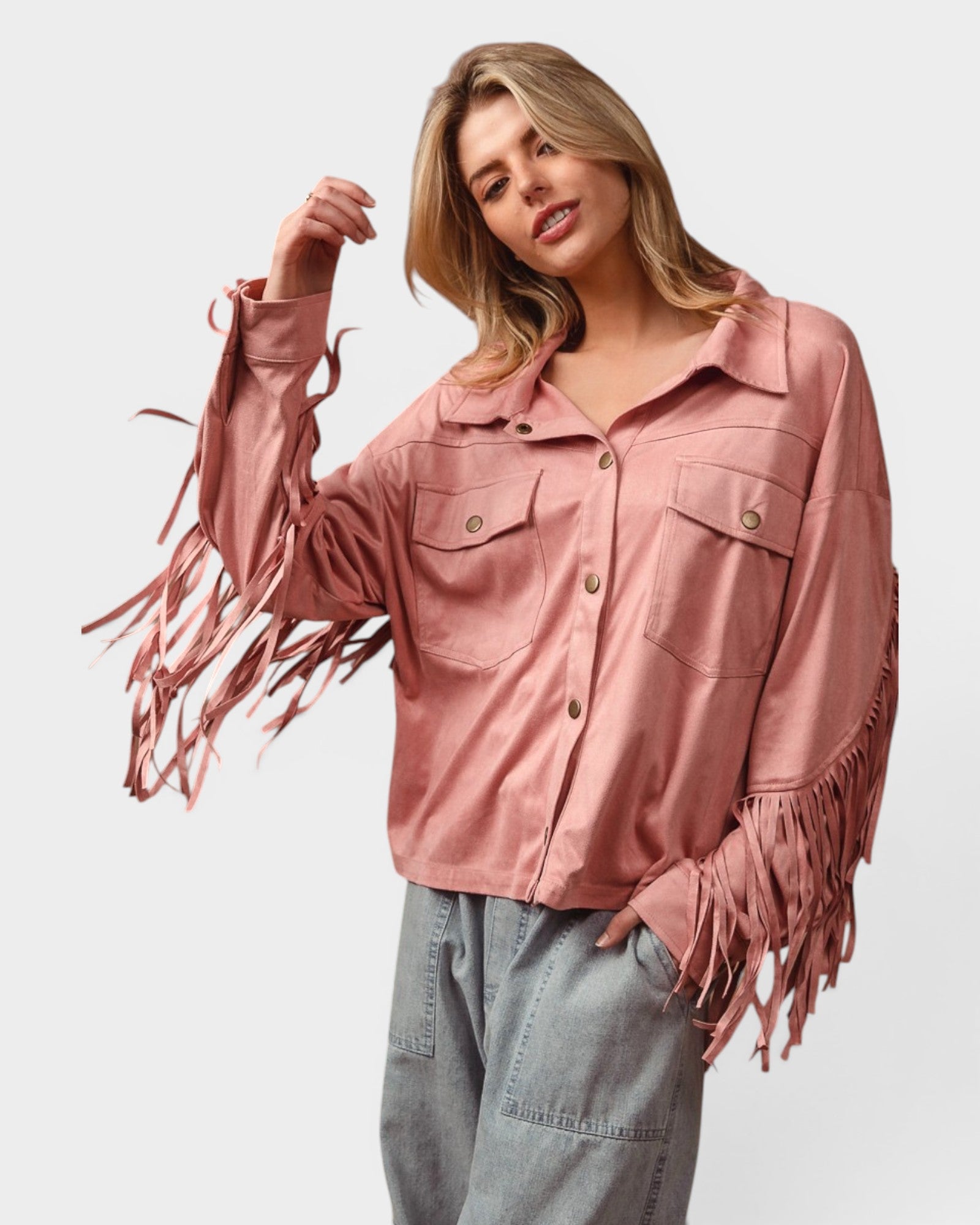 Woman wearing a pink fringed jacket on a white background