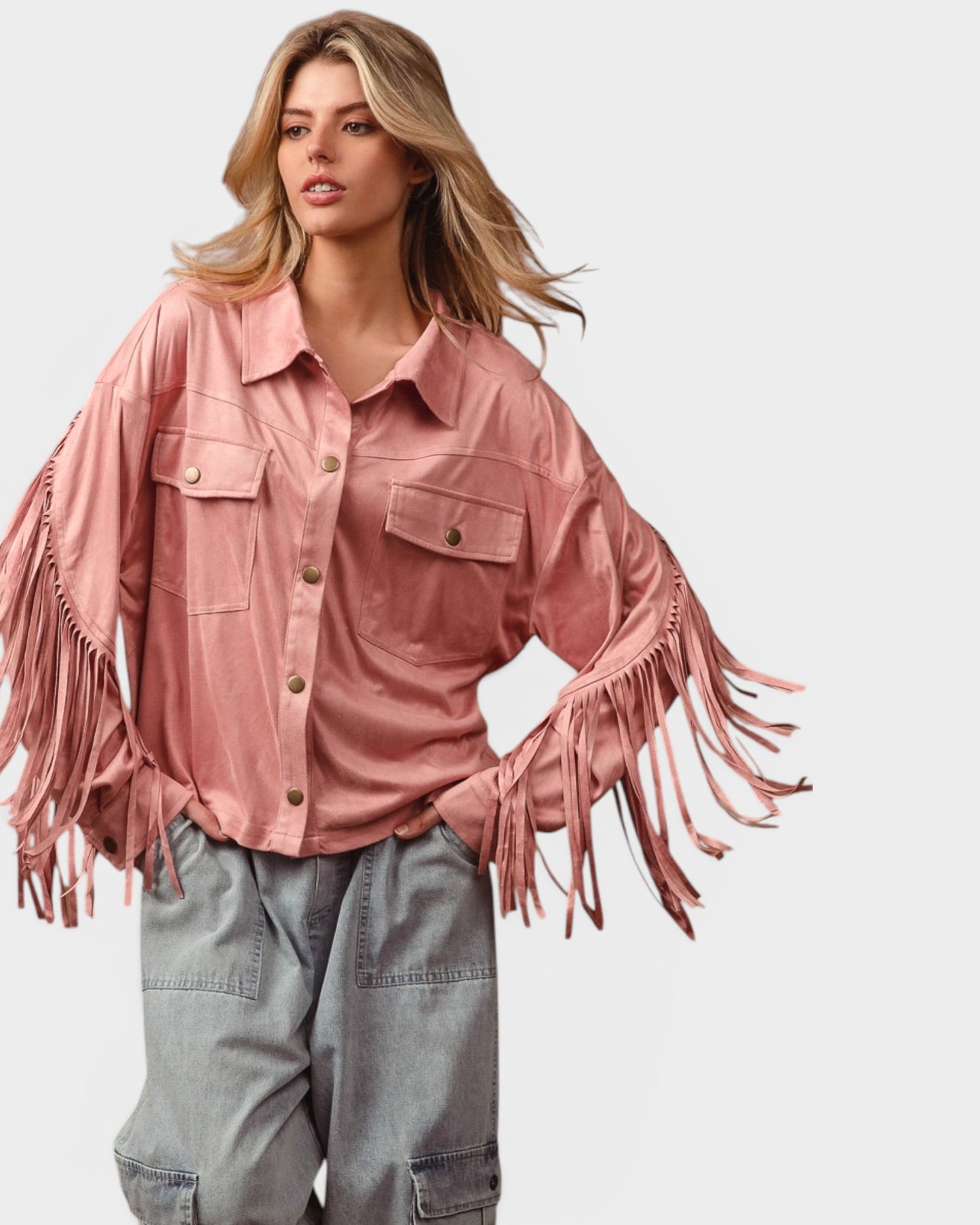 Woman wearing a pink fringed jacket on a light gray background