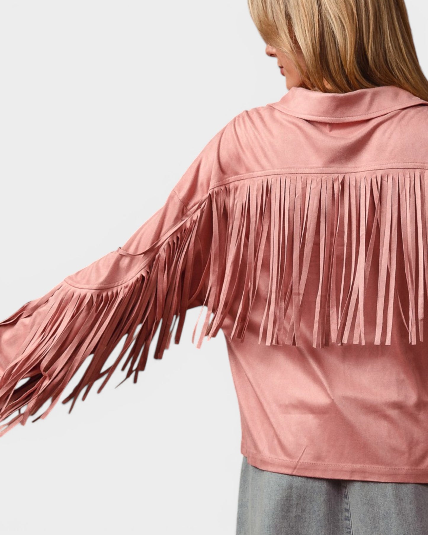 Pink fringed jacket worn by a person on a light gray background