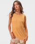 Woman wearing a mustard yellow sleeveless knitted top on a white background