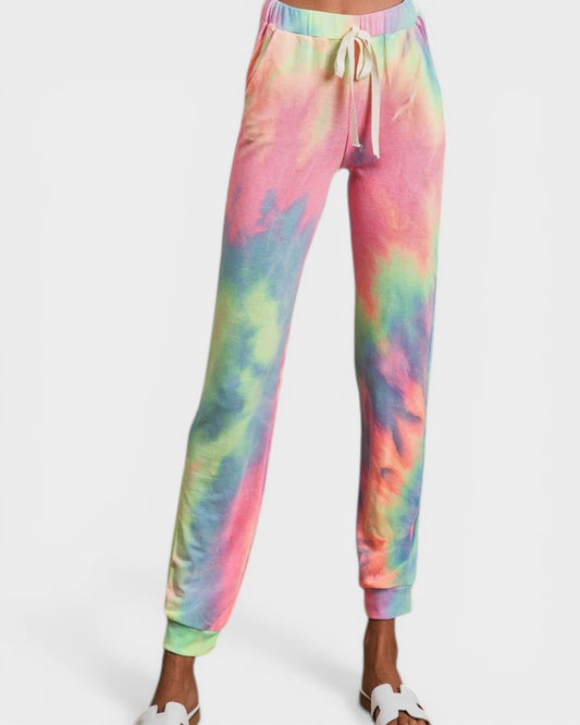 Colorful tie-dye jogger pants on a white background