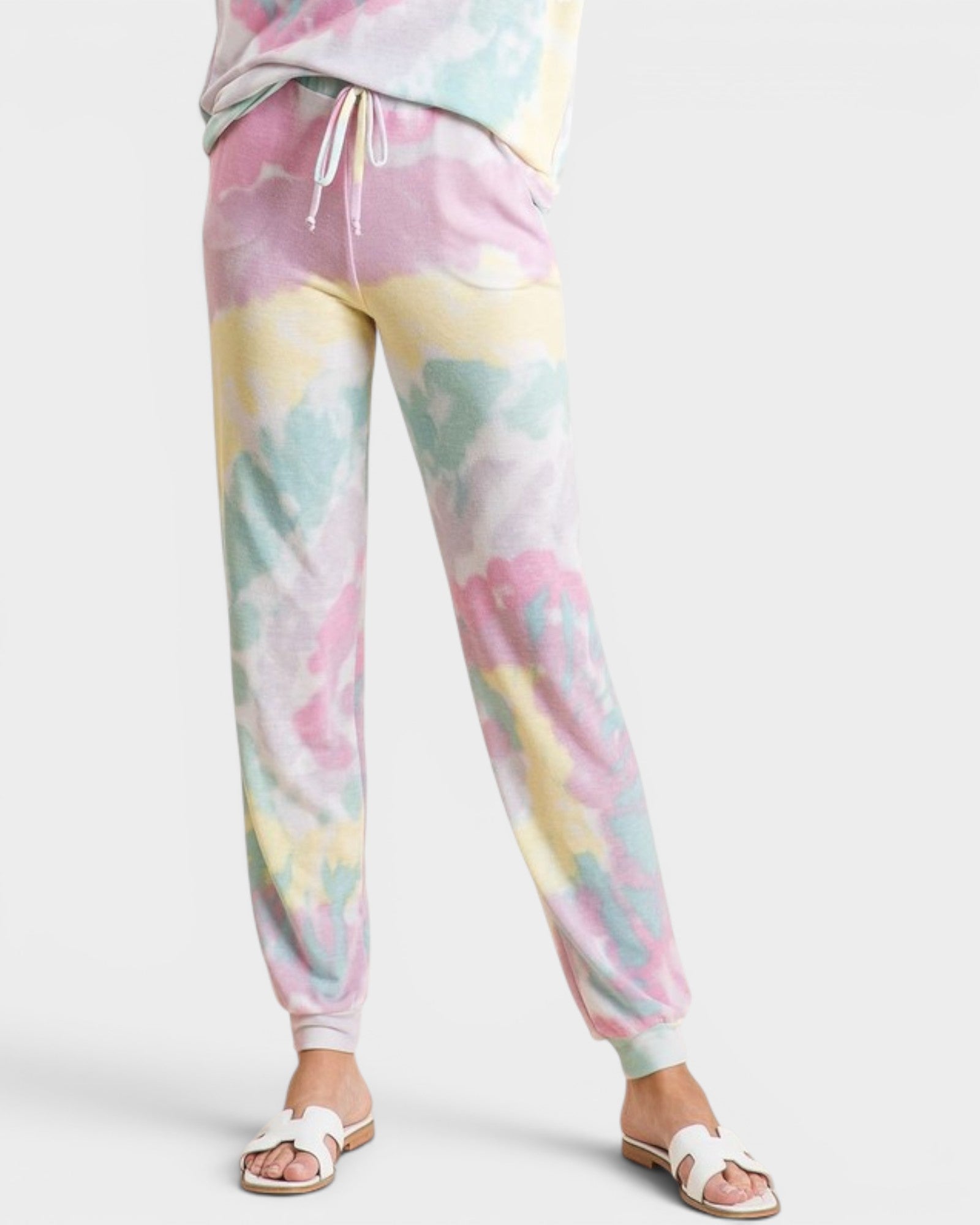 Pastel tie-dye sweatpants on a white background
