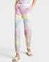 Pastel tie-dye jogger pants worn by a person on a white background