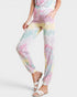 Person wearing a pastel tie-dye outfit on a white background