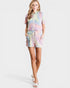 Woman wearing a tie-dye outfit on a white background