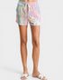 Tie-dye shorts worn by a person on a white background