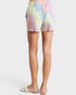 Pastel tie-dye shorts worn by a person on a white background