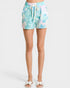 Tie-dye shorts worn by a person on a white background