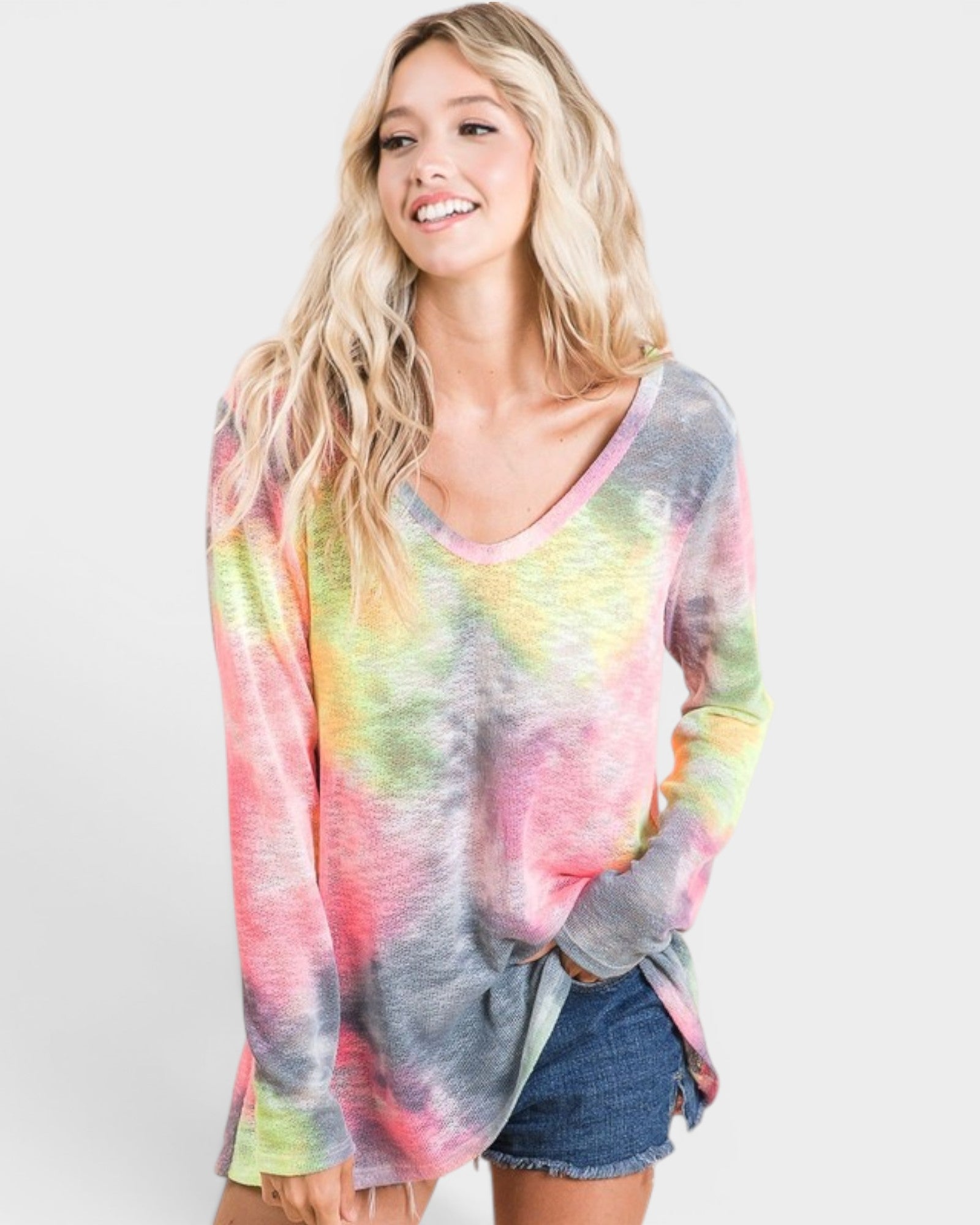Woman wearing a tie-dye long-sleeve shirt on a white background