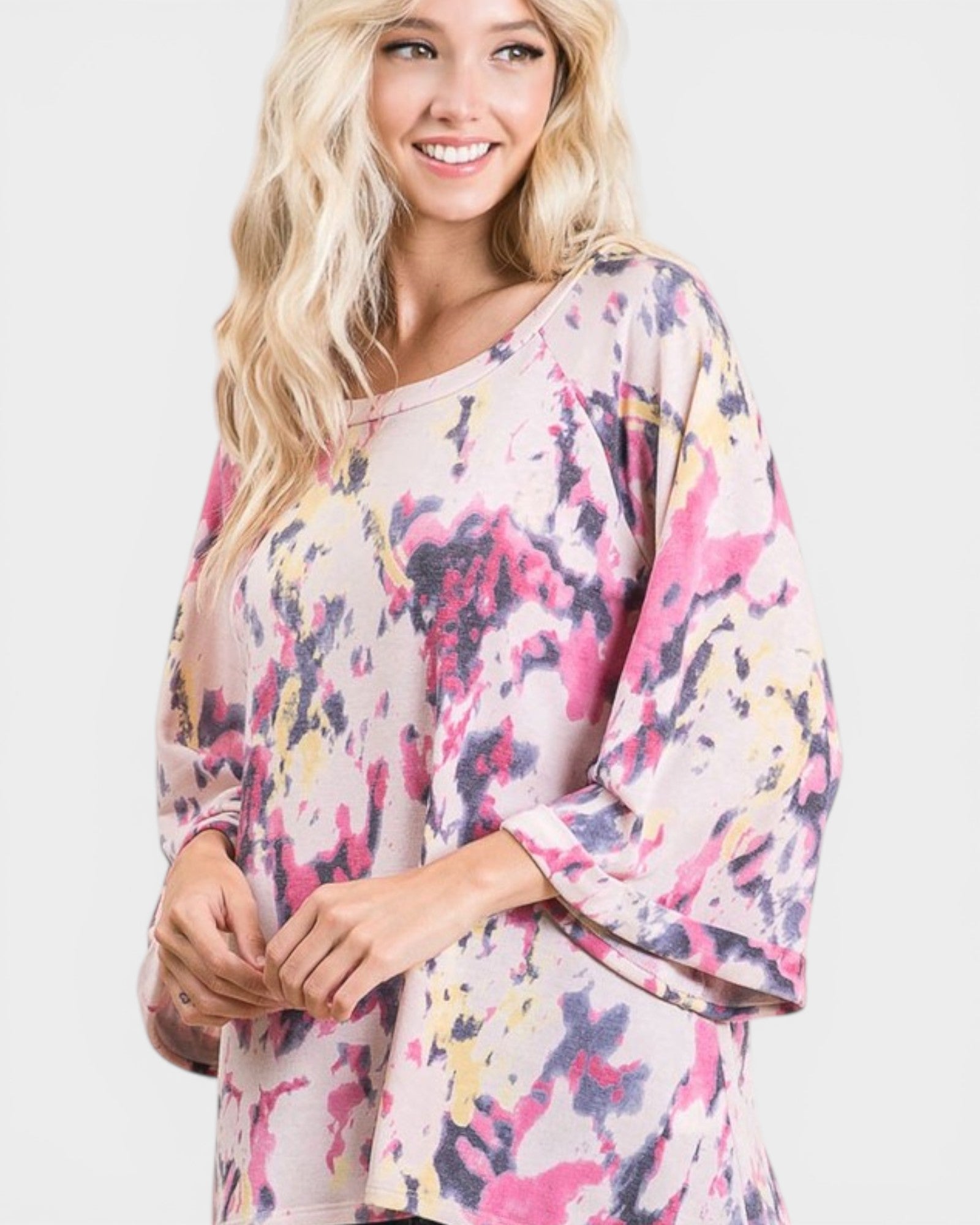 Woman wearing a colorful floral dress on a white background