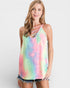 Woman wearing a colorful tie-dye tank top on a white background