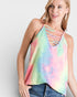 Woman wearing a colorful tie-dye tank top against a plain background