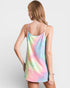 Woman wearing a tie-dye dress on a plain background