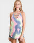 Woman wearing a tie-dye tank top with strappy details on a white background