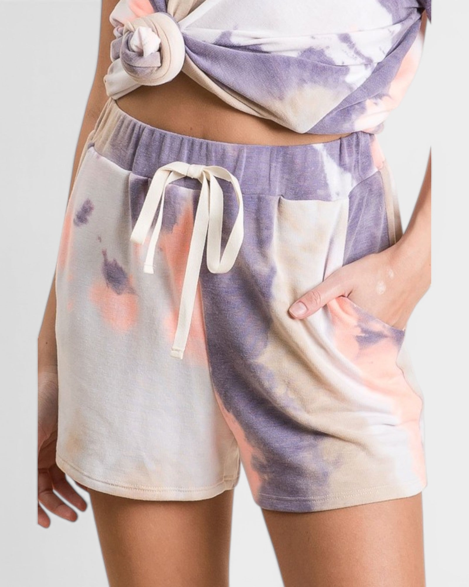 Tie-dye shorts with a matching top on a plain background