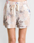 Floral patterned shorts worn by a person on a white background
