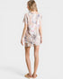Woman wearing a floral dress on a white background