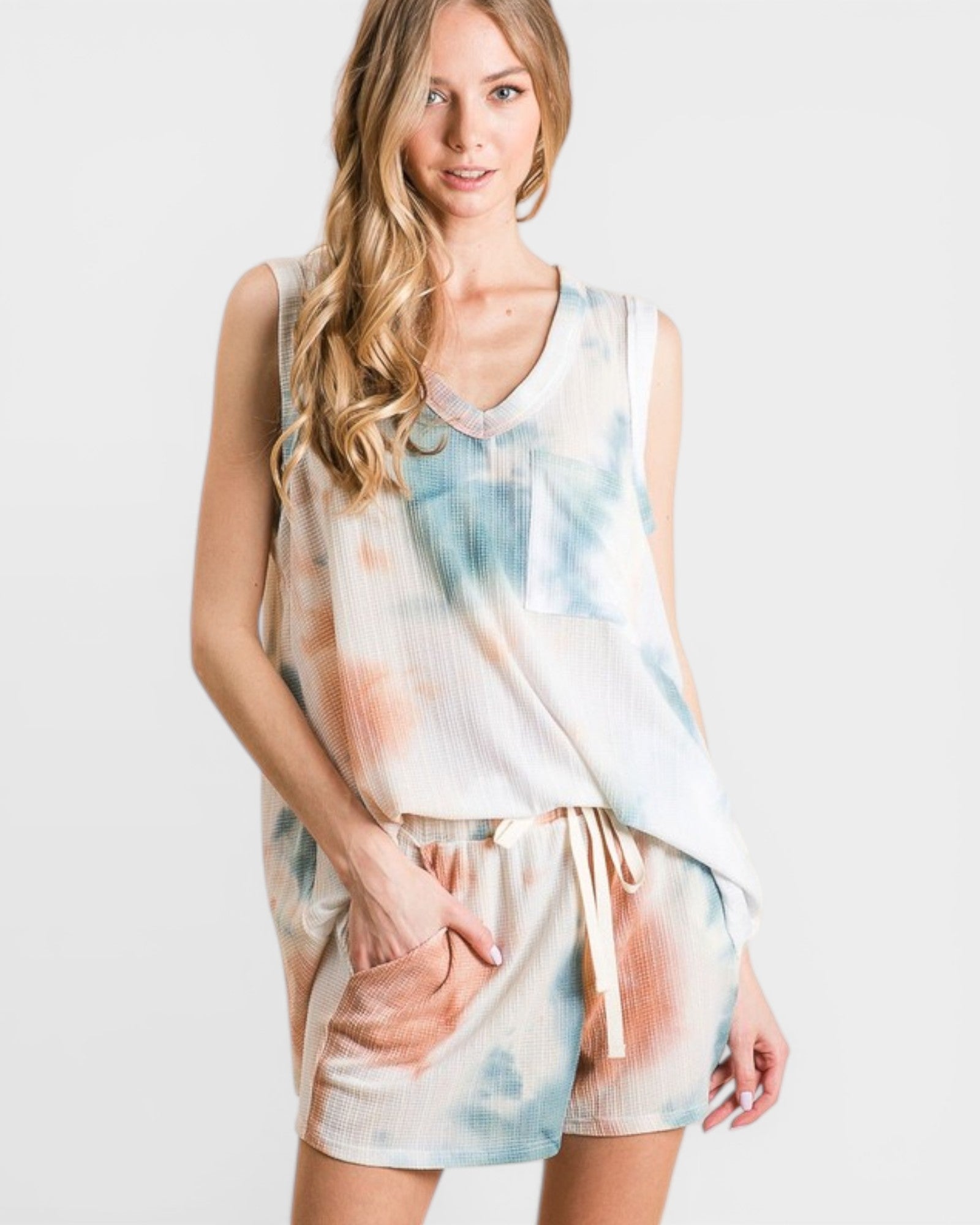 Woman wearing a tie-dye outfit on a white background