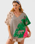 Woman wearing a colorful kimono with tiger designs on a plain background