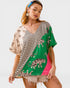 Woman wearing a colorful kimono-style top with tiger designs on a white background