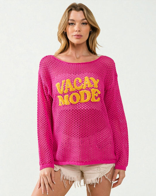 Woman wearing a pink sweater with 'Vacay Mode' text on a white background