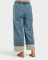 Blue denim pants with lace trim on a white background