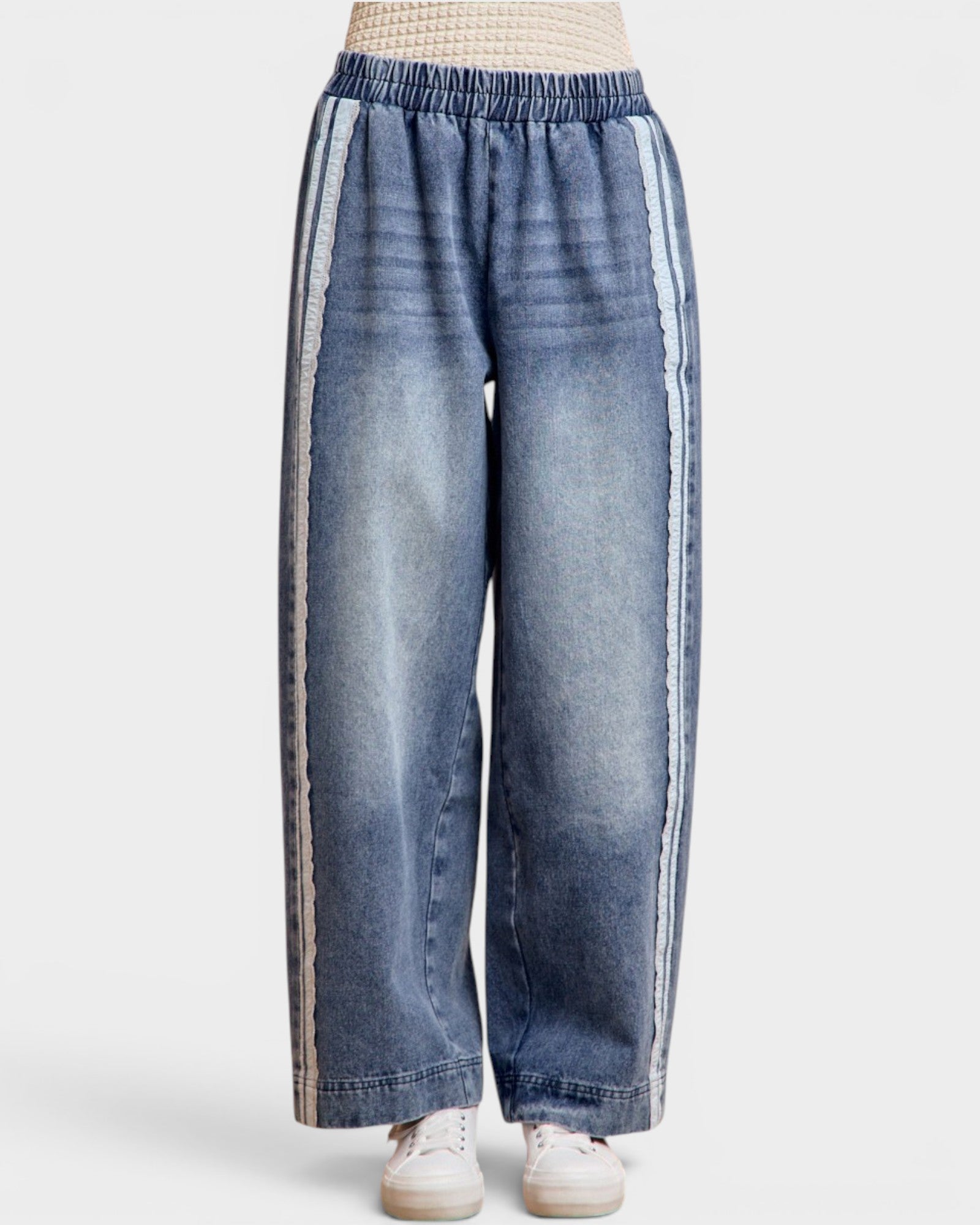 Blue jeans with white stripes on a white background