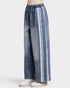 Denim pants with white stripes on a white background