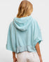 Light blue hoodie worn by a person on a white background