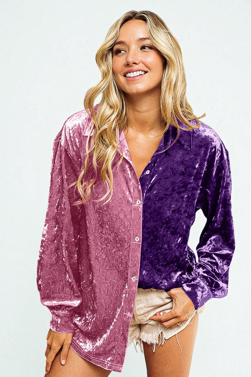 Woman wearing a two-tone velvet shirt with pink and purple sections on a white background