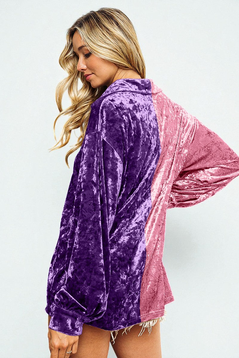 Woman wearing a two-tone purple and pink velvet jacket on a white background