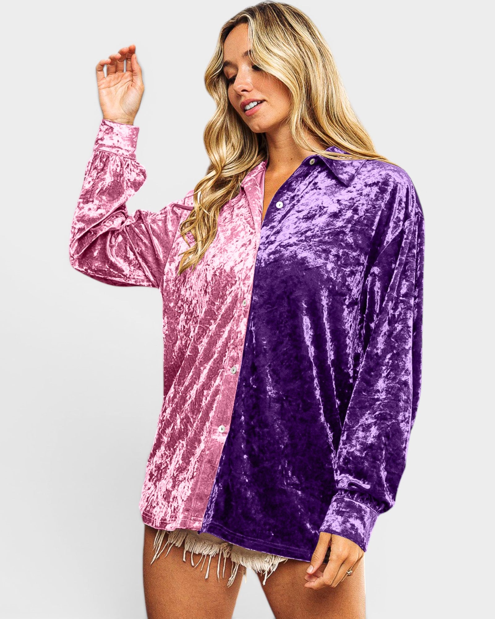 Woman wearing a pink and purple velvet shirt on a white background